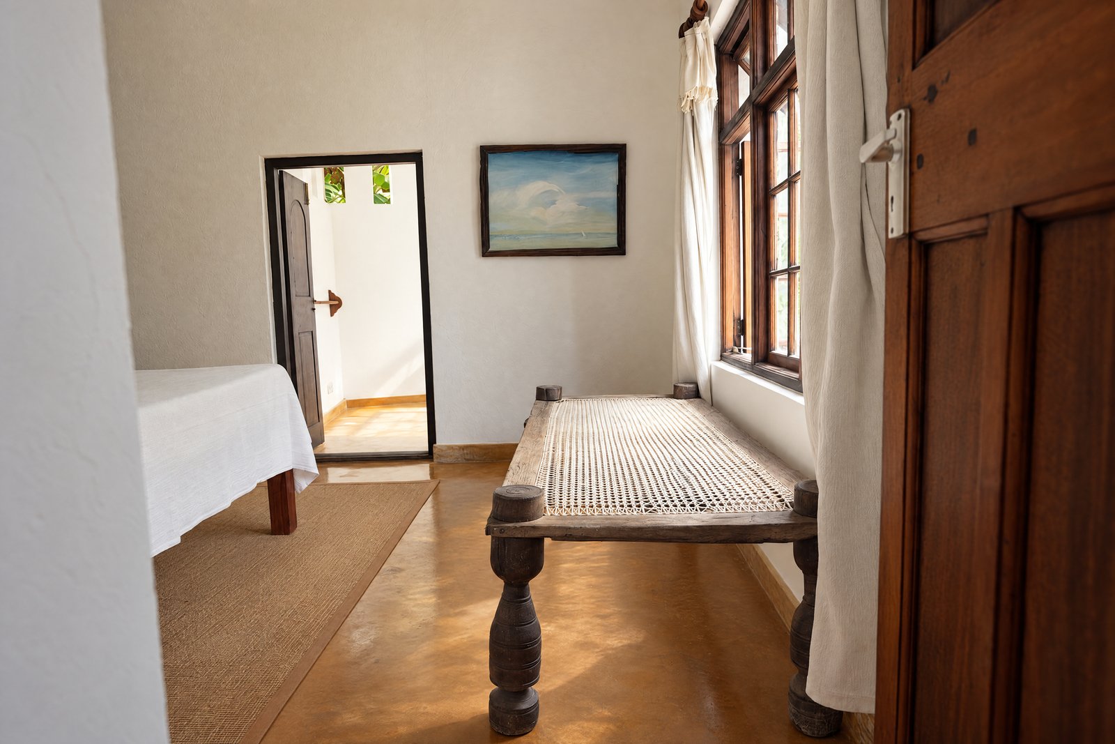 Reverse view with daybed and doorway