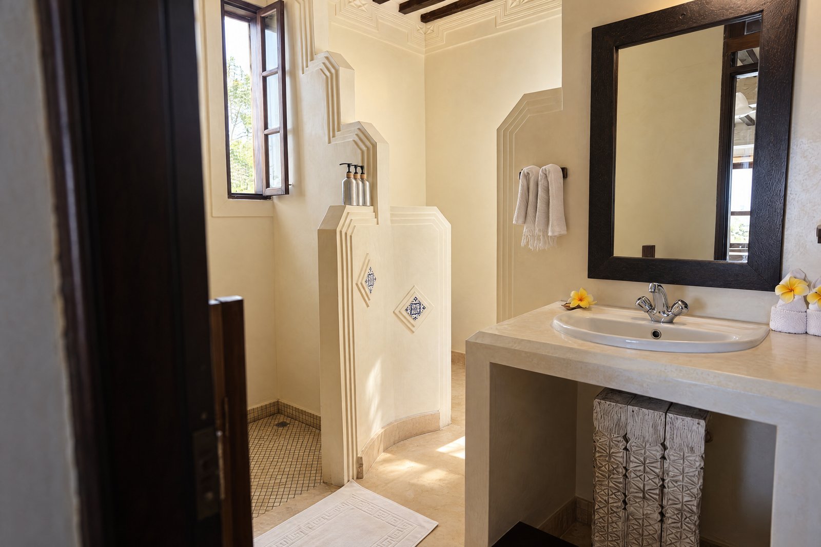 Bathroom vanity and carved plaster