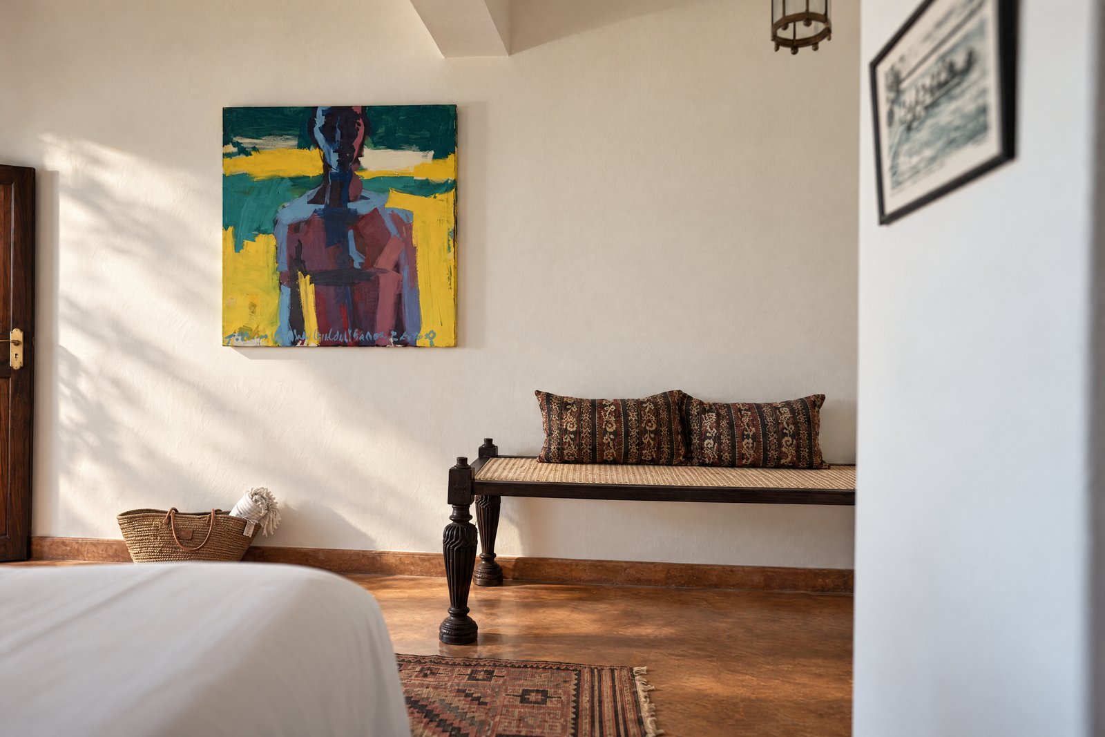 Seaview bedroom artwork and carved daybed