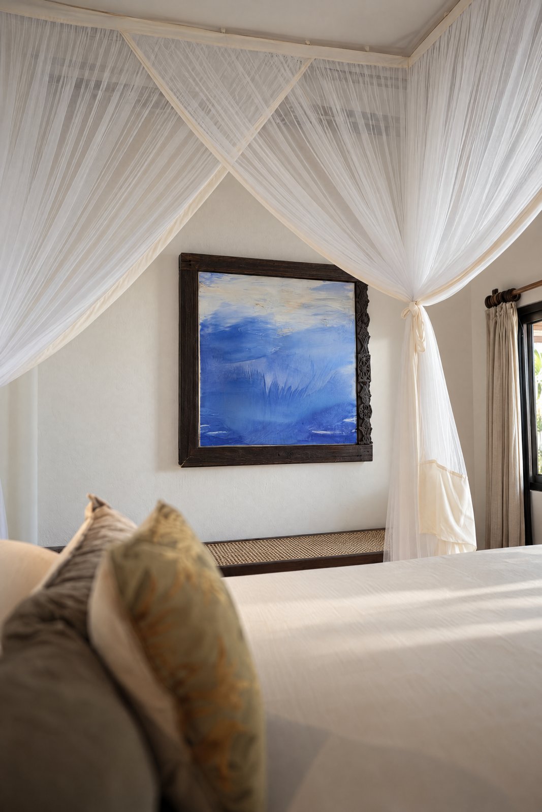 Canopy bedroom · blue painting through the net