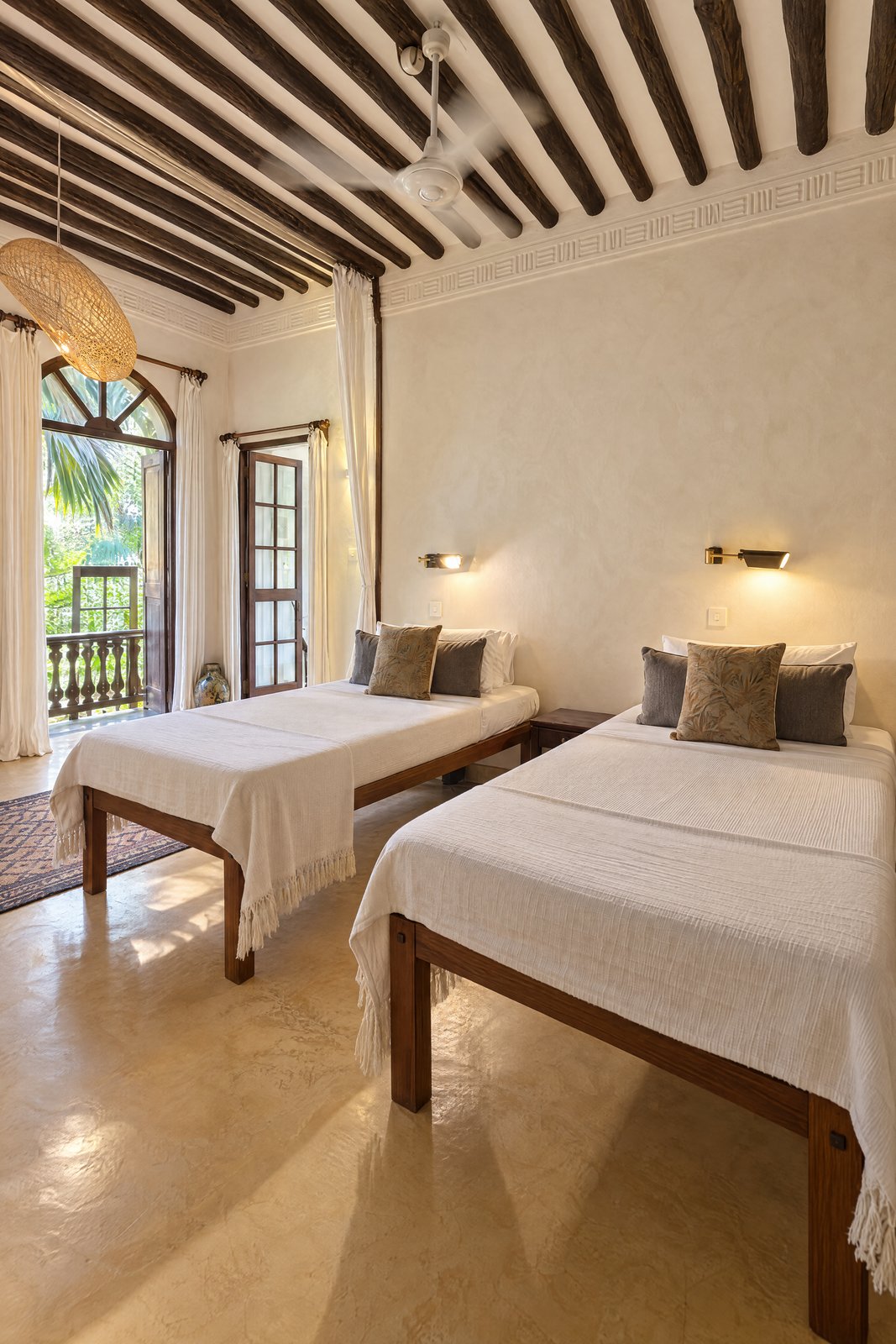 Both beds toward the glazed balcony doors