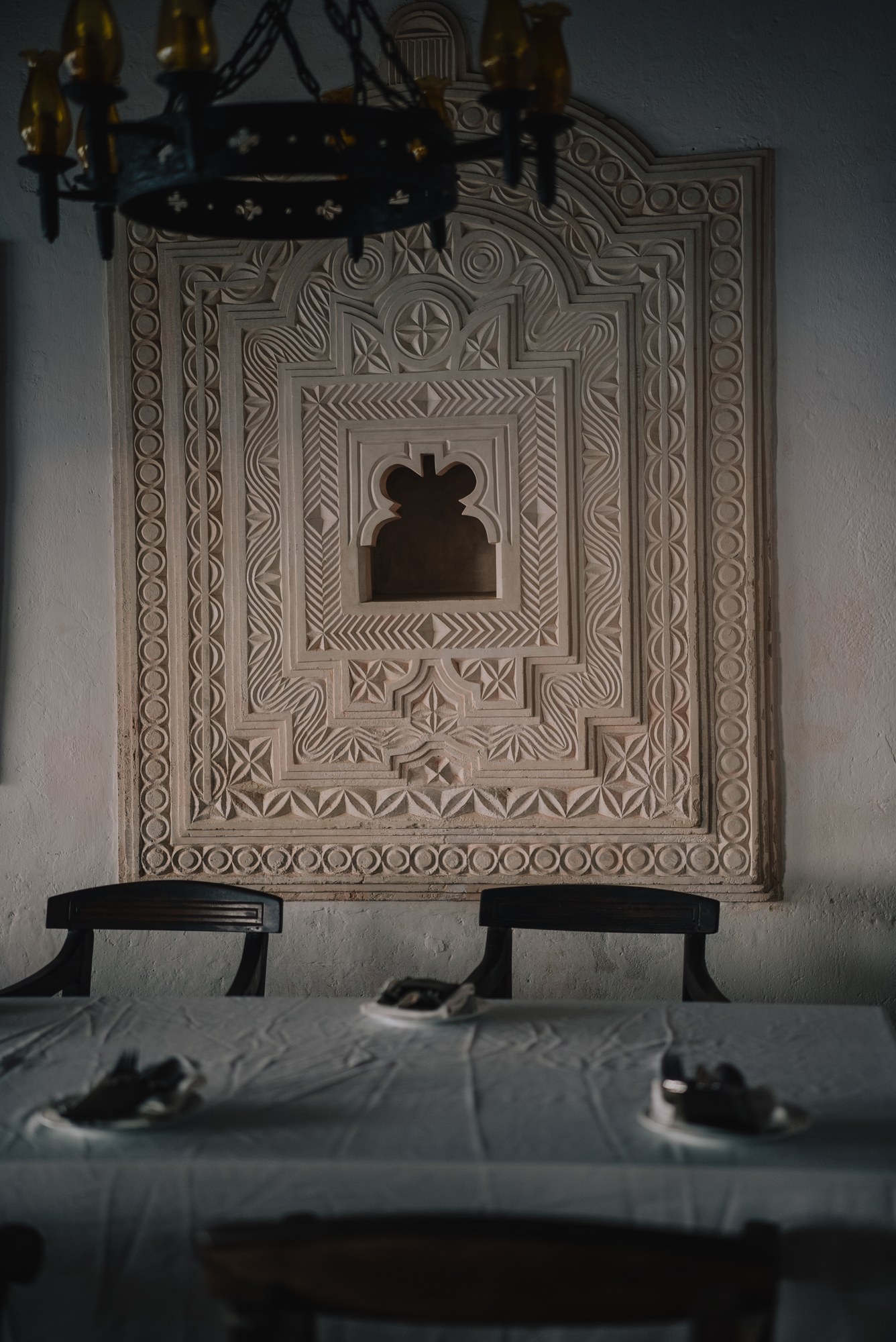 Carved plaster and a timber bench