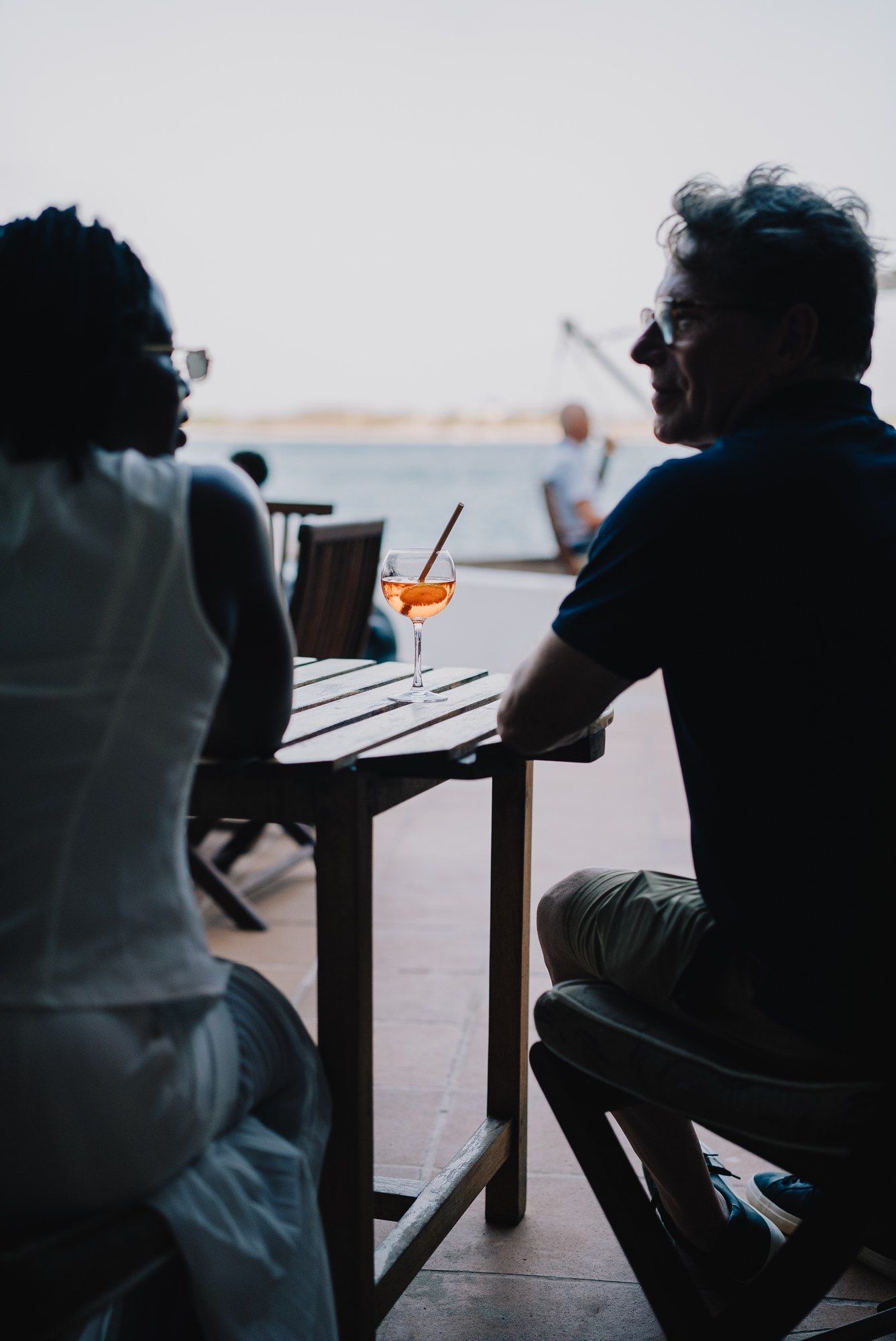 Conversation beside the water