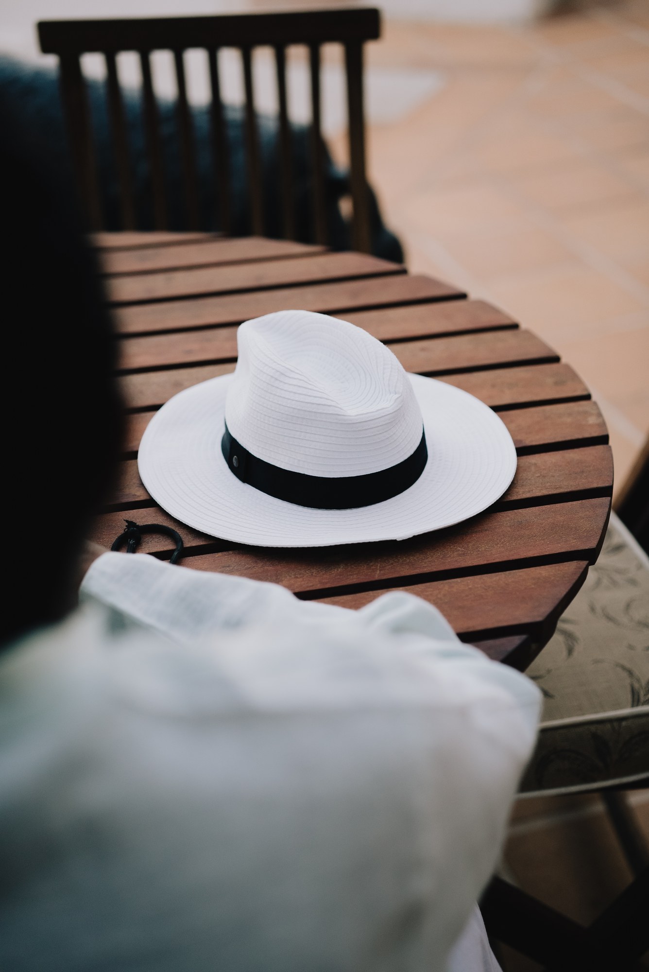 A white hat on the terrace table