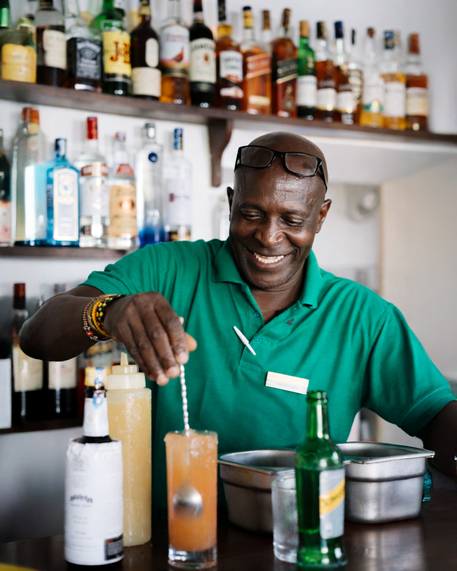 Making a drink behind the bar