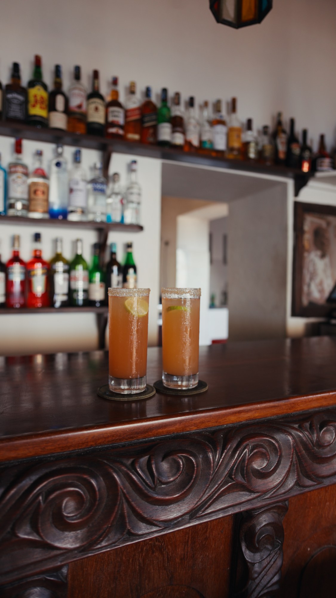 Two cocktails on the carved counter