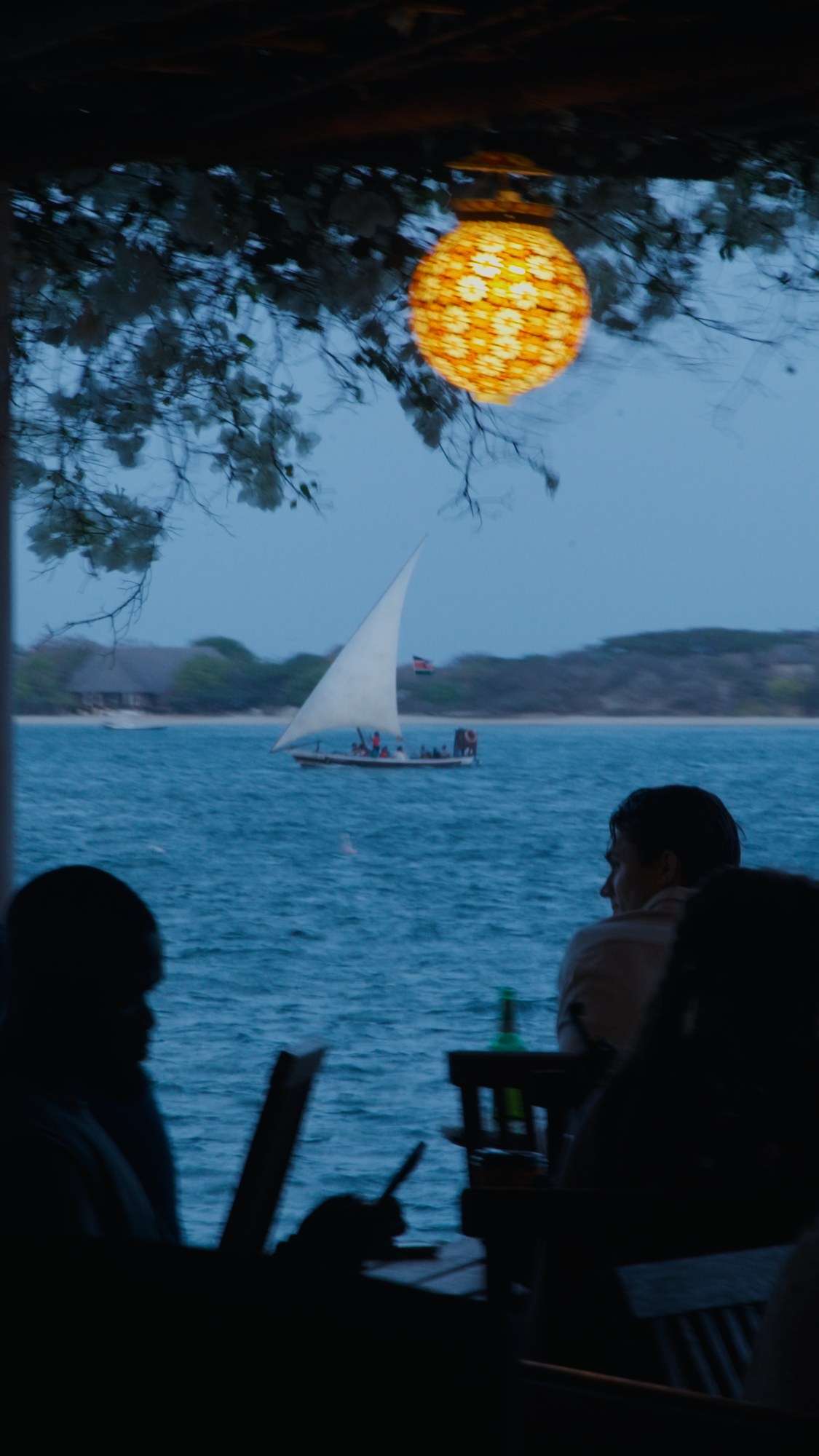 A glowing lantern at blue hour